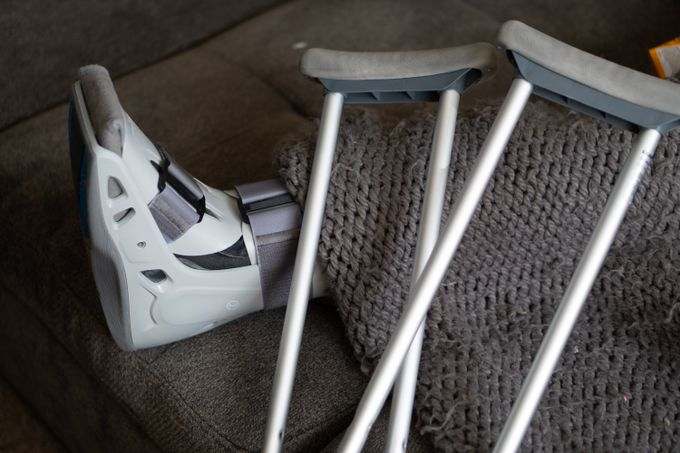 Orthopedic boot and crutches during limb lengthening recovery